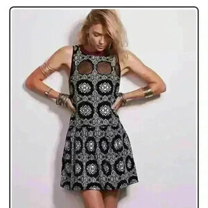 FREE PEOPLE exclusive mini dress with deep V back. Size  xs